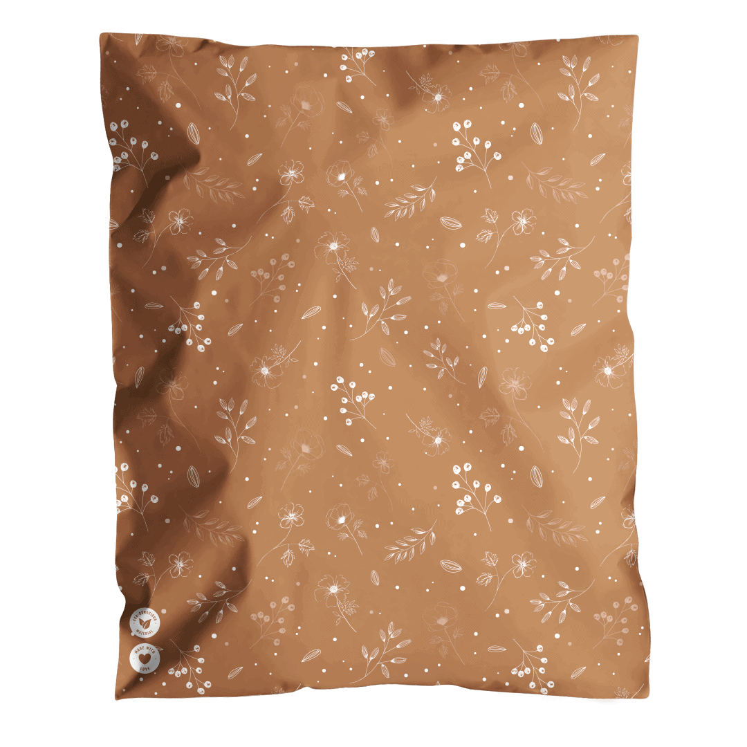 A piece of brown fabric with white floral patterns, two buttons, and is packaged in impack.co Floral 2D Chestnut Biodegradable Mailers 12" x 15.5".