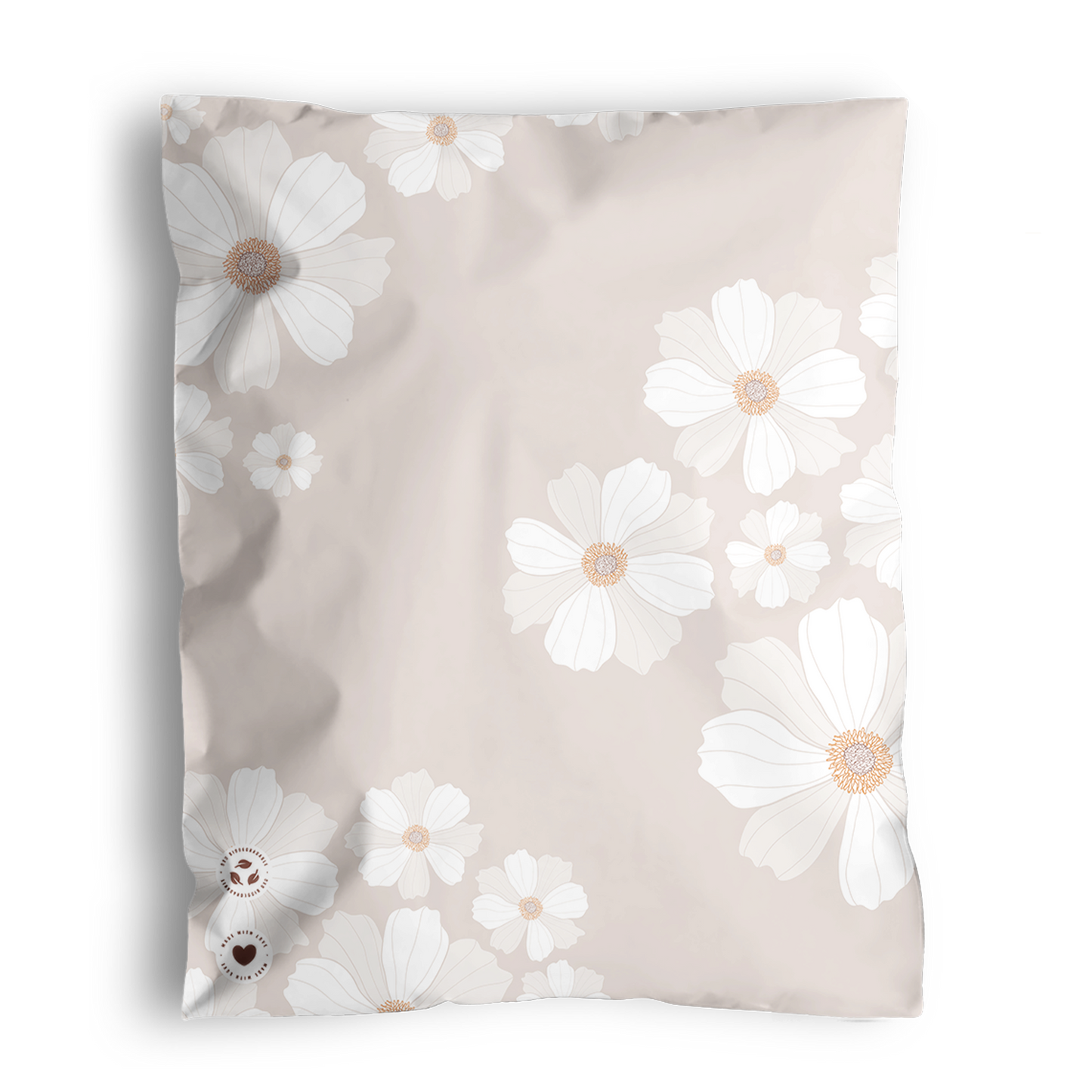 A square pillow with a floral pattern featuring white daisies on a light beige, recyclable background made by impack.co showcasing the Cosmos Biodegradable Mailers 10" x 13".
