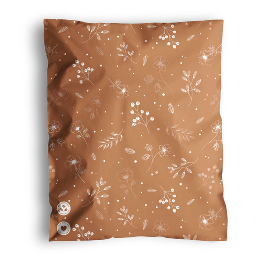 A Floral 2D Chestnut Biodegradable Mailer 14.5" x 19" from impack.co with white flowers on it.