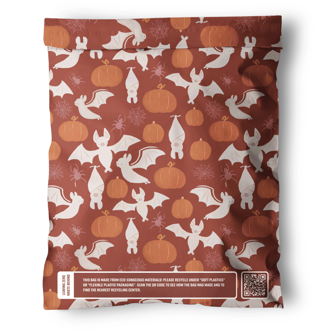 A limited-edition Halloween Bats Mailers 10" x 13" bag from impack.co with a spooky pattern of pumpkins and bats.