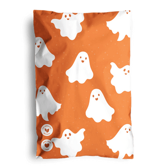 Orange bedding featuring a pattern of white cartoon ghosts, perfect for eco-friendly impack.co Halloween Ghost Pumpkin Biodegradable Mailers 6" x 9" decorations.