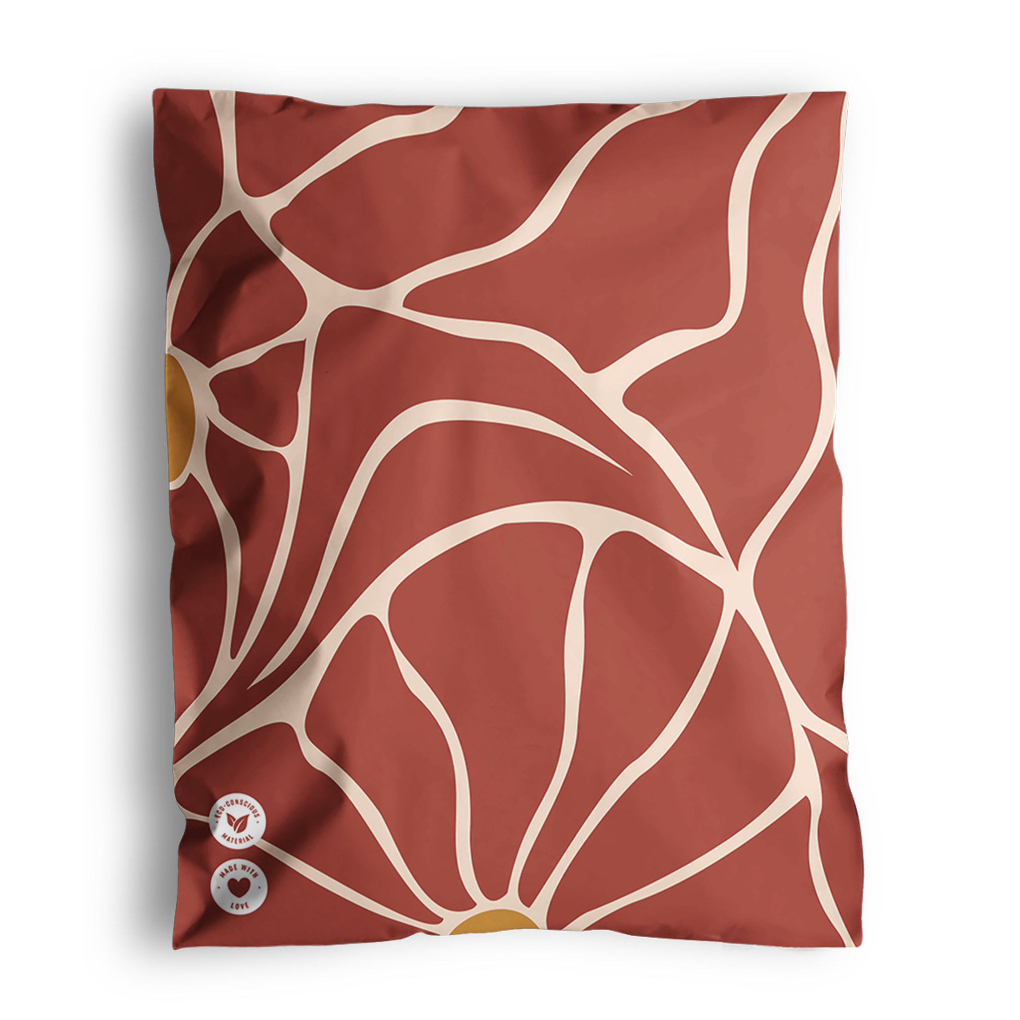 A red cloth with beige abstract floral patterns, featuring the Crimson Crove Mailers 10" x 13" by impack.co print and two small round patches with symbols in the lower left corner.
