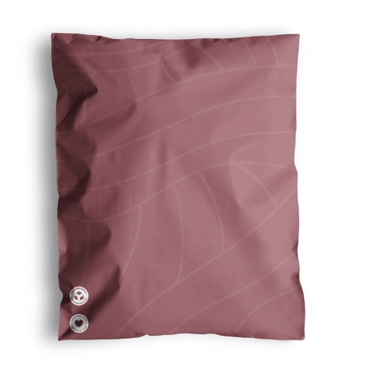 Illustration of a pink fabric swatch with two buttons on impack.co's Copper Rose Leaf Biodegradable Mailers 10" x 13".