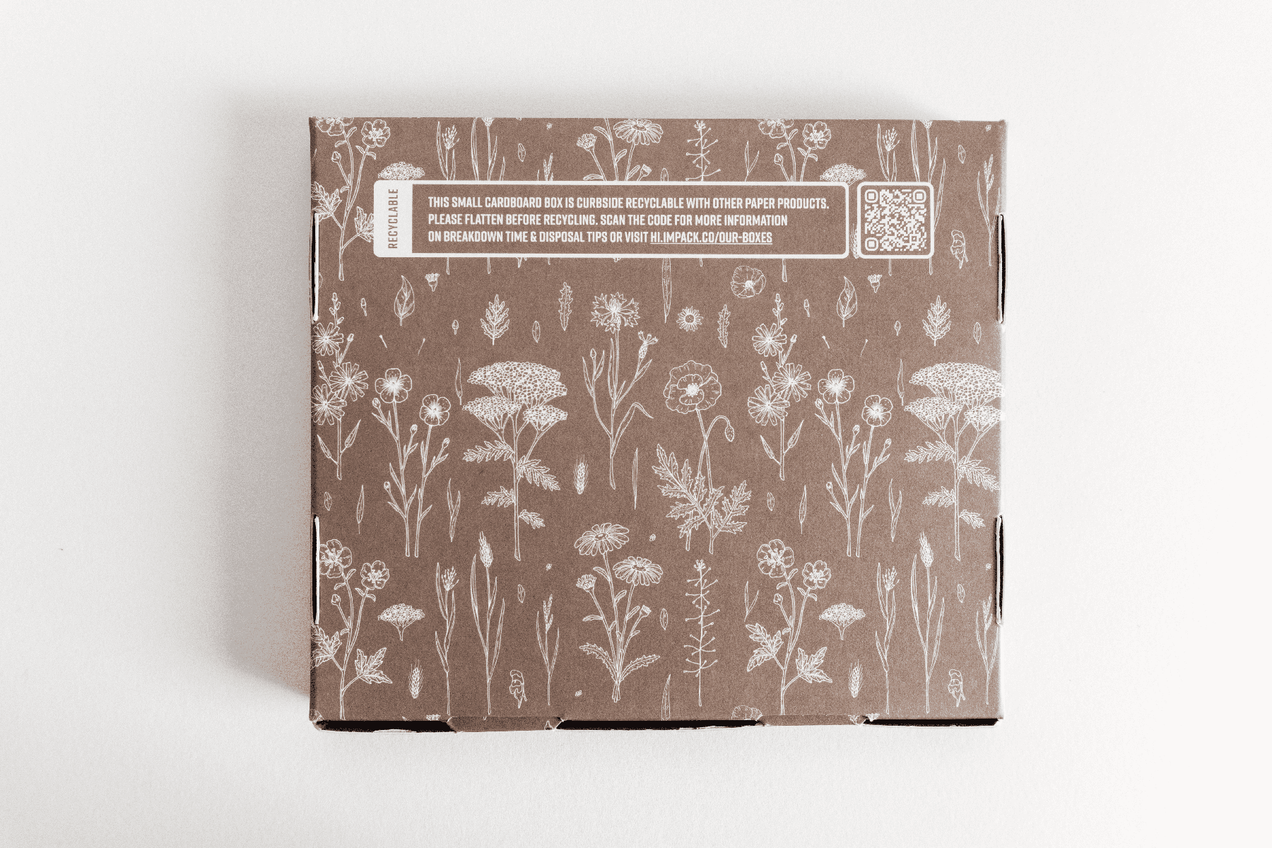 A brown SlimBox Wildflower 7" x 8" - Large with flowers on it by impack.co.