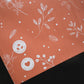 A Floral 2D Rosy Brown Biodegradable Mailer 10" x 13" by impack.co with a design on it.