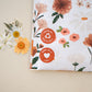A Gardenlumina Padded Paper Mailers 10" x 13" bag with flowers and an impack.co sticker on it.