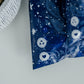 An impack.co Midnight Indigo Mailers 10" x 13" recyclable bag with stars on it.