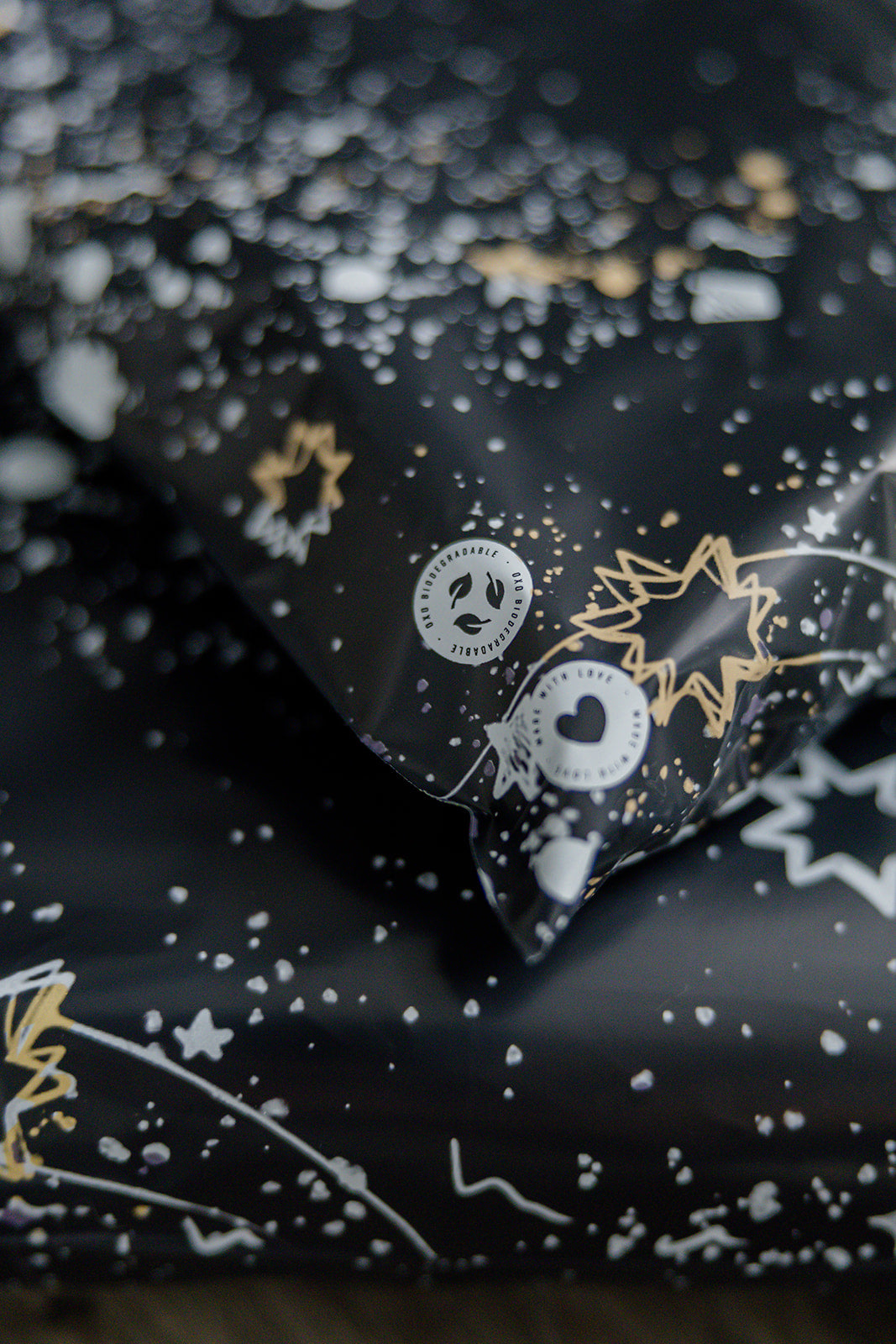 A recyclable Midnight Galaxy Mailers 14.5" x 19" wrapping paper with stars on it by impack.co.