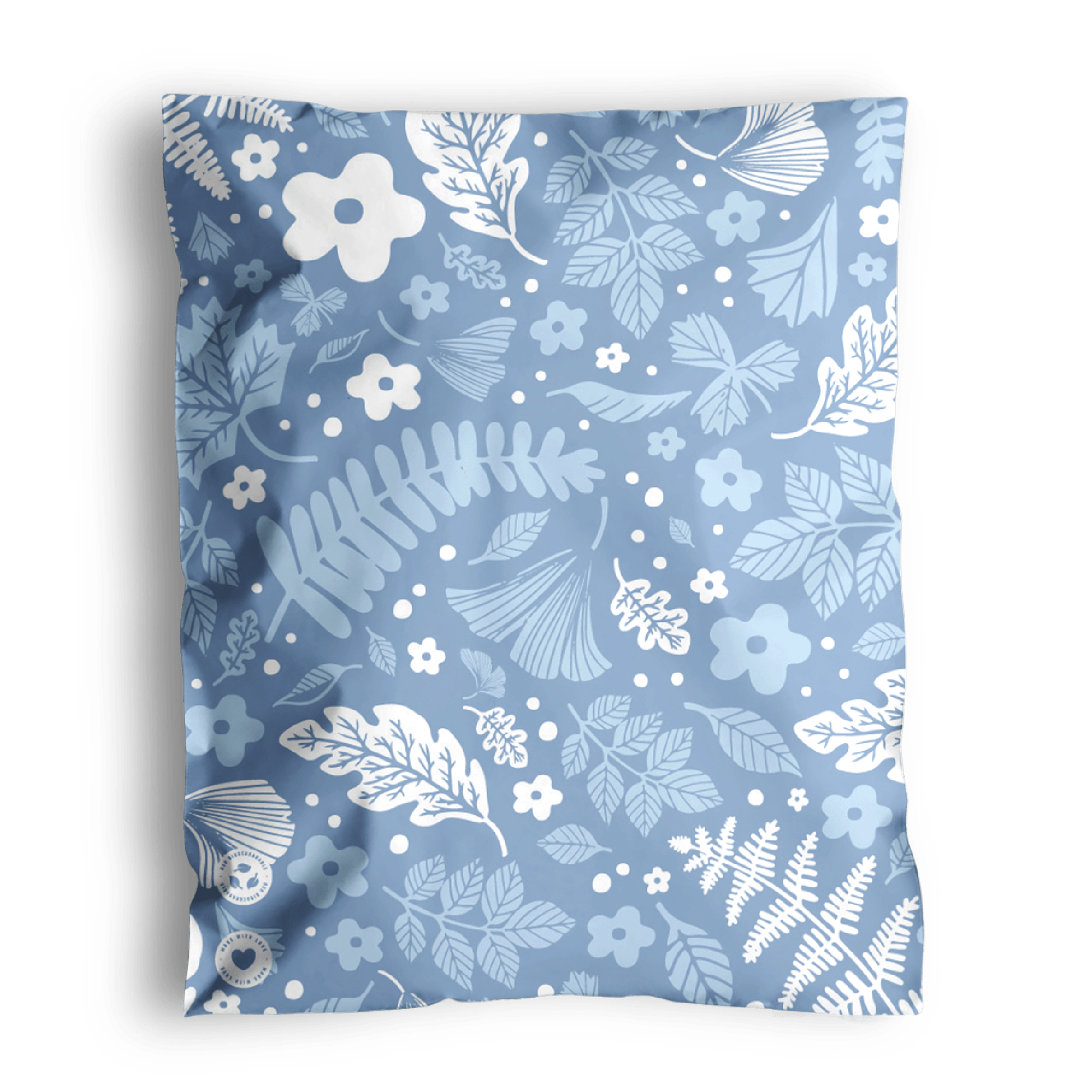 A patterned fabric with floral and leaf designs, perfect for creating Sapphire Evergreen Biodegradable Mailer Bags 10" x 13" by impack.co.