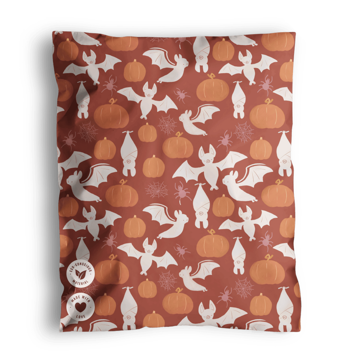 Halloween-themed biodegradable fabric featuring ghosts, pumpkins, and bats on a brown background from impack.co.