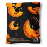 The impack.co Halloween Pumpkitties Mailers (10" x 13") feature a black pouch with orange moon and witch hat cat designs, plus a QR code and “Leaving Zero Waste Behind” label—an eco-friendly alternative for small shipments.