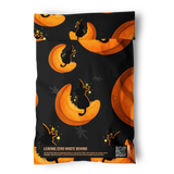 The Halloween Pumpkitties Mailers 6" x 9" by impack.co feature a black resealable bag with orange crescent moons, black cats, and gold stars. "Leaving Zero Waste Behind" and a QR code are at the bottom—perfect for eco-friendly shipping.