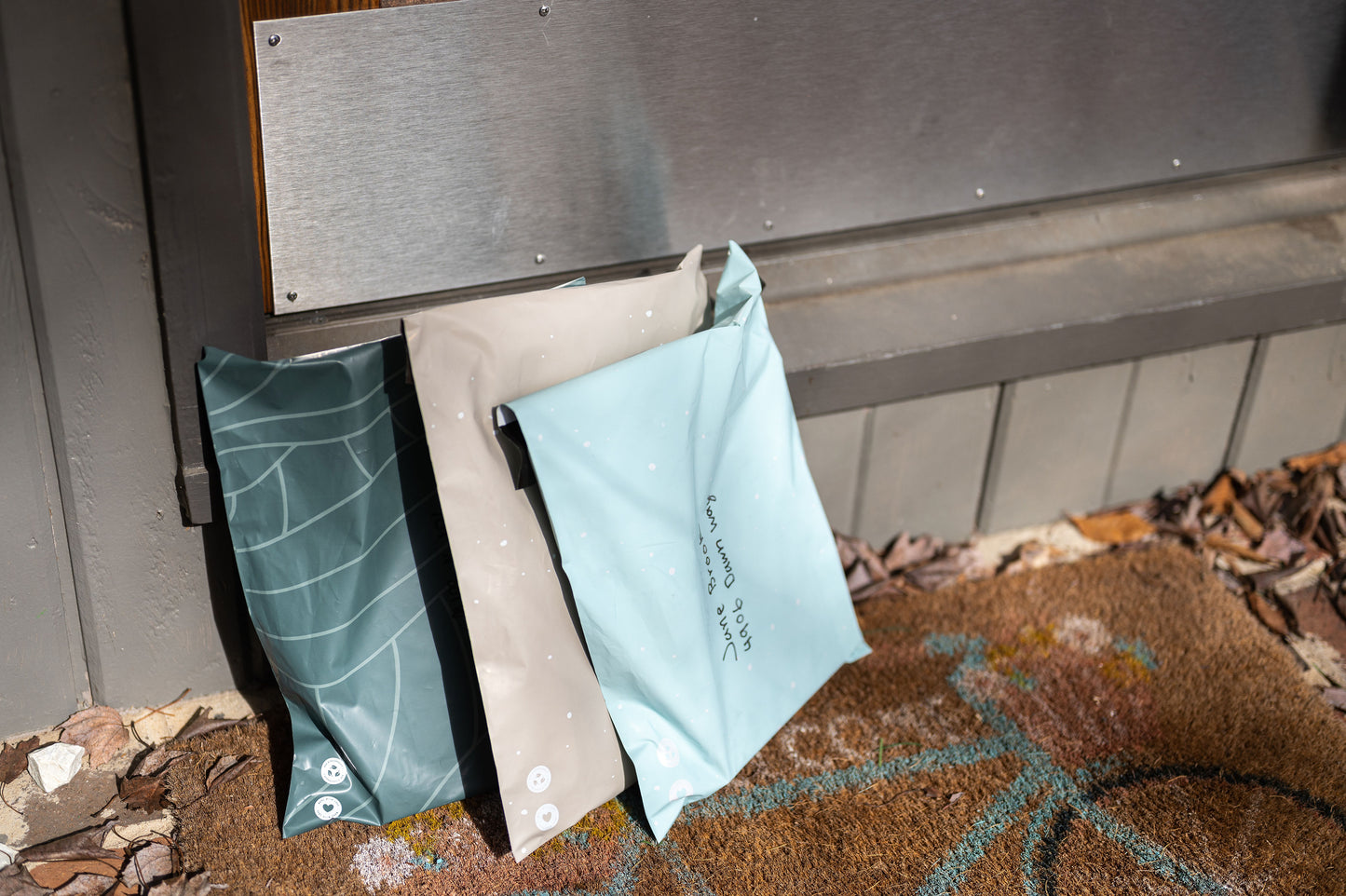 A mailbox with Starry Baby Blue Biodegradable Mailers 10" x 13" - Canada Stock from impack.co hanging on it.