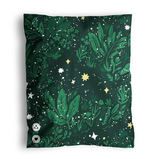 A patterned bandana with green foliage and star motifs on a dark background, packaged in impack.co Midnight Lush Mailers 10" x 13".