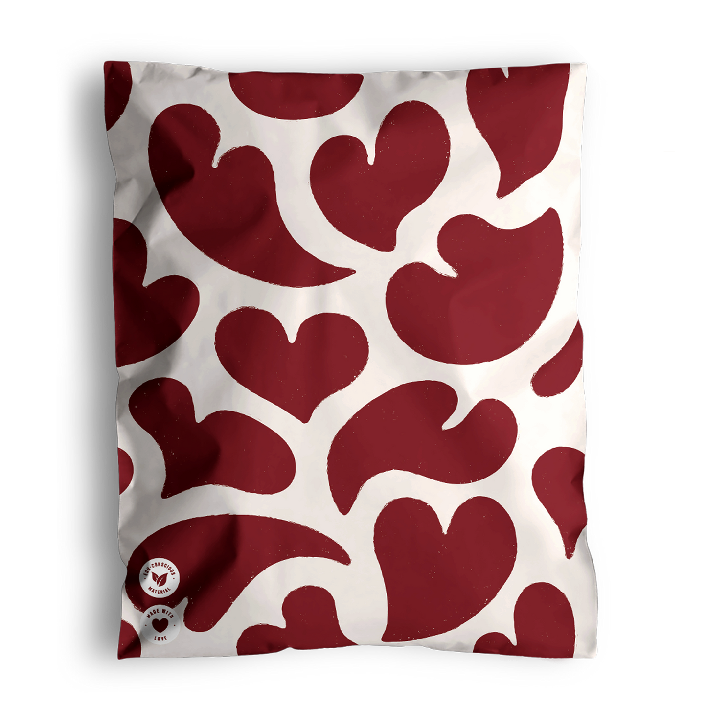 A cushion with impack.co's Red Hearts Biodegradable Mailers 10" x 13", perfect for Valentine Print Mailers.