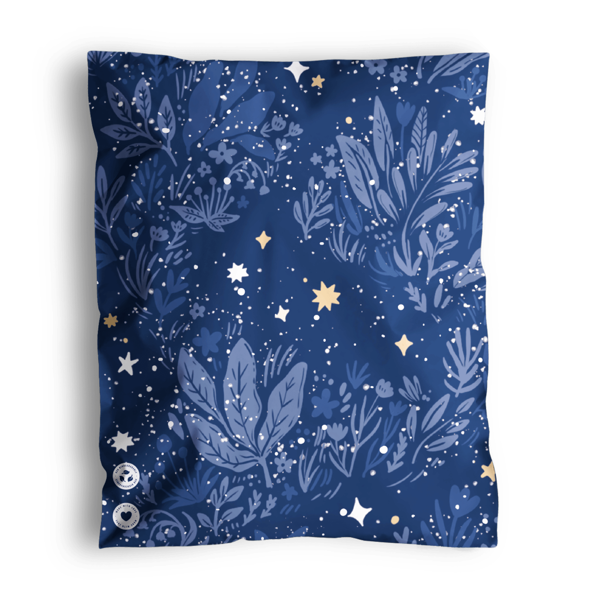 A patterned blue Midnight Indigo Mailers 10" x 13" scarf with botanical and starry motifs, displayed on a dark background, now comes in recyclable packaging by impack.co.