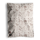 The Wildflower Biodegradable Mailers from impack.co feature a crumpled fabric design adorned with a pattern of brown flowers and plants on a white background, exuding an eco-friendly charm. Tiny buttons in the bottom left corner subtly echo the intricate details commonly seen on biodegradable mailers.