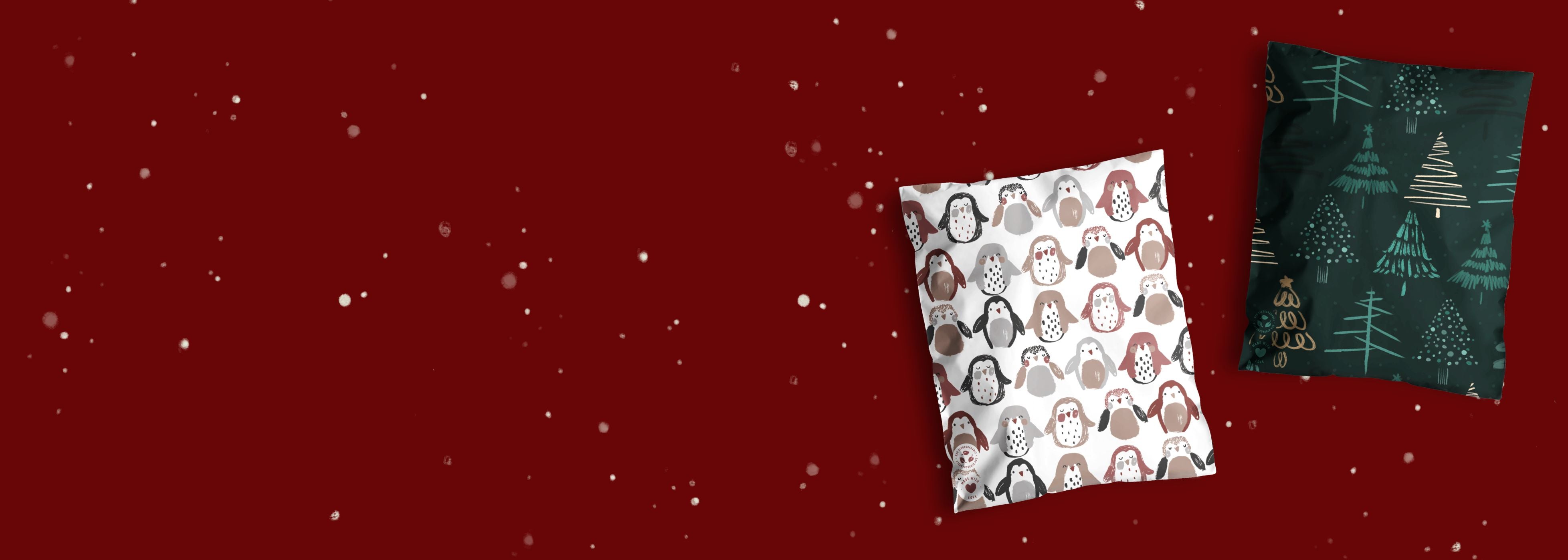 Two decorative pillows with festive patterns on a maroon background with white specks resembling snow.