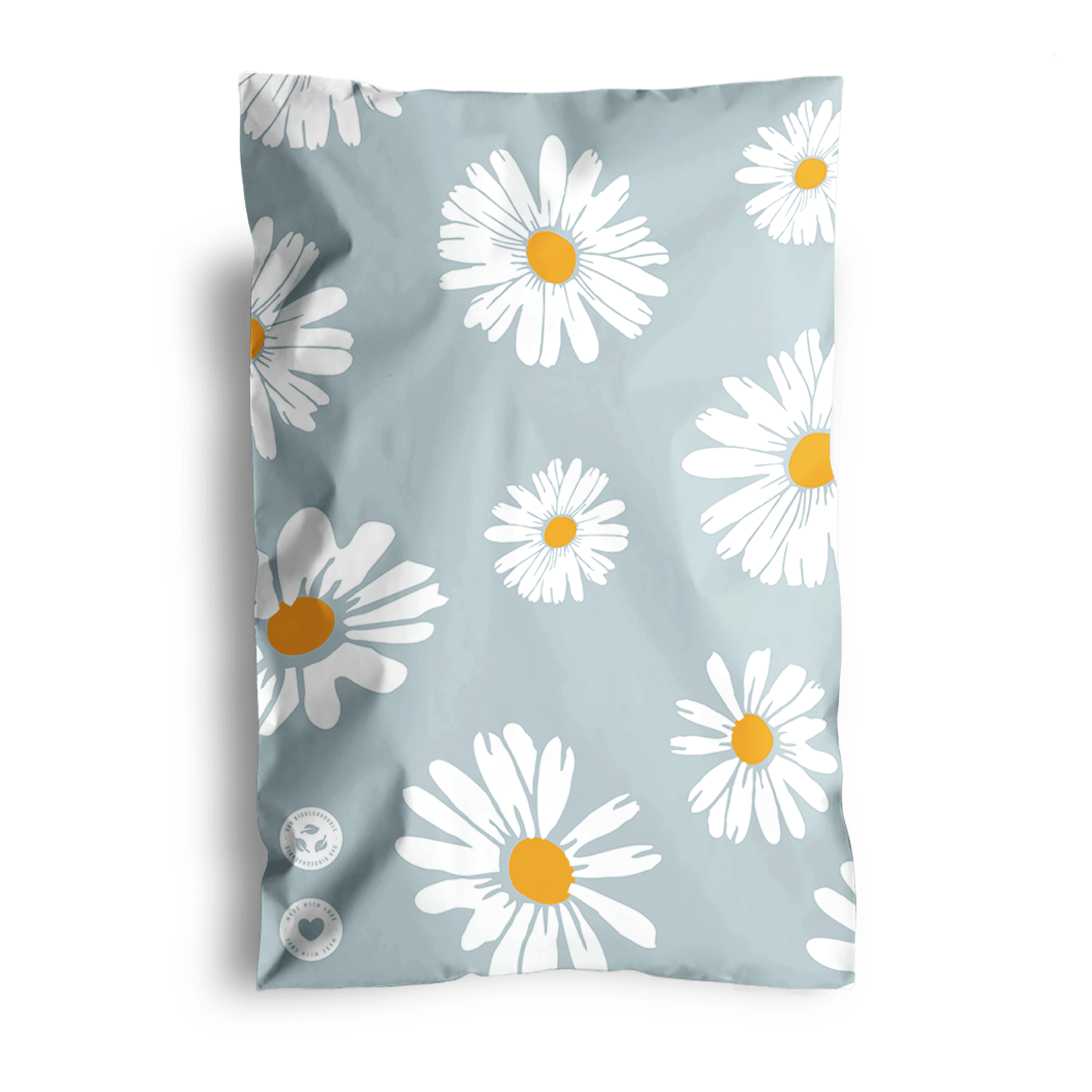 A comforter with a daisy flower print design displayed against a dark background and shipped in impack.co's Daisy White Biodegradable Mailers 6" x 9".