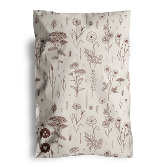 A biodegradable mailer by impack.co featuring a beige cover with brown line drawings of various flowers and leaves.