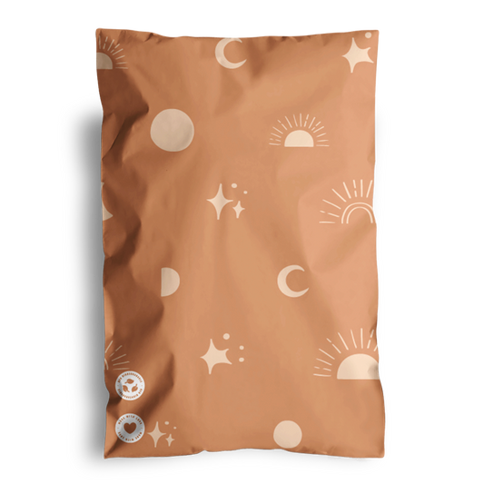 An unopened, sealed snack package with a Celestial Tan Mailers 6" x 9" design, enclosed in impack.co biodegradable mailer bags.