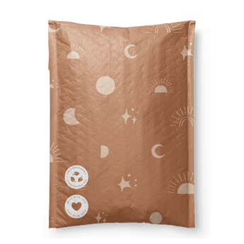 A patterned brown blanket or throw with Celestial Tan Biodegradable Bubble Mailers 8.5" x 12" designs folded on a dark, recycle-friendly surface by impack.co.