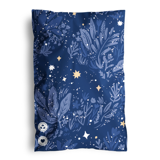 A navy blue scarf with a botanical and starry pattern, shipped in impack.co Midnight Indigo Mailers 6" x 9".