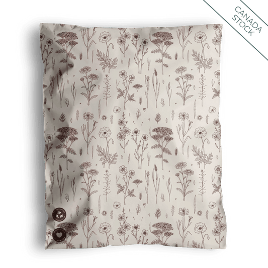 A brown and white Wildflower Mailers 10" x 13" - Canada pillow with flowers on it from impack.co.