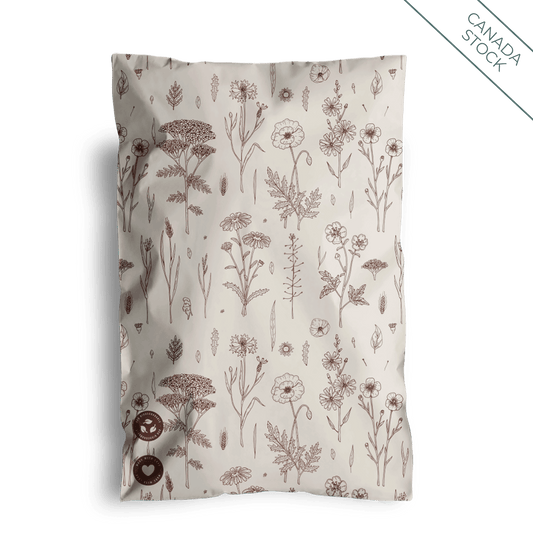 A brown and white Wildflower Mailers 6" x 9" - Canada pillow with flowers on it from impack.co.
